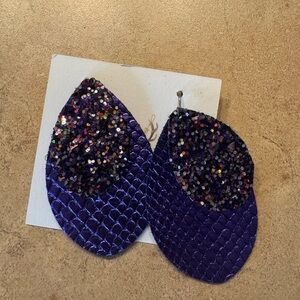 - Purple glitter and leather earrings. Two layers